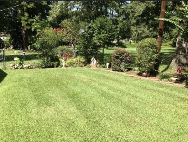 Lawnmowing side yard by HIS Way Services, Texarkana